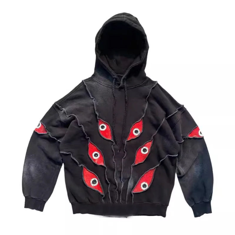 Unisex Black Red Eye Patchwork Hoodie - primary photo, shown with a person