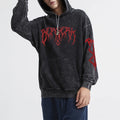 Unisex Charcoal Acid Wash Graphic Hoodie - alternate view, shown with a person (4 of 4)