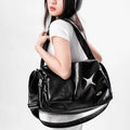 Women's Black Star-Emblem Faux Leather Tote - primary photo, shown with a person (1 of 3)