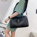 Women's Black Rhinestone Skull Studded Satchel - primary photo, shown with a person (1 of 4)