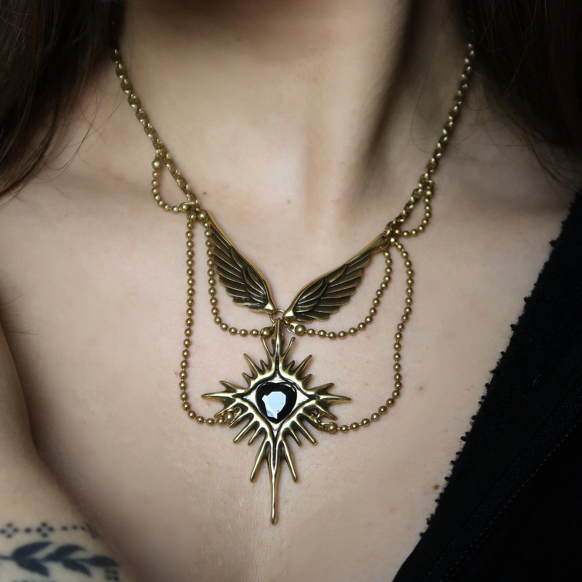 CELESTIAL STARBURST WINGS NECKLACE