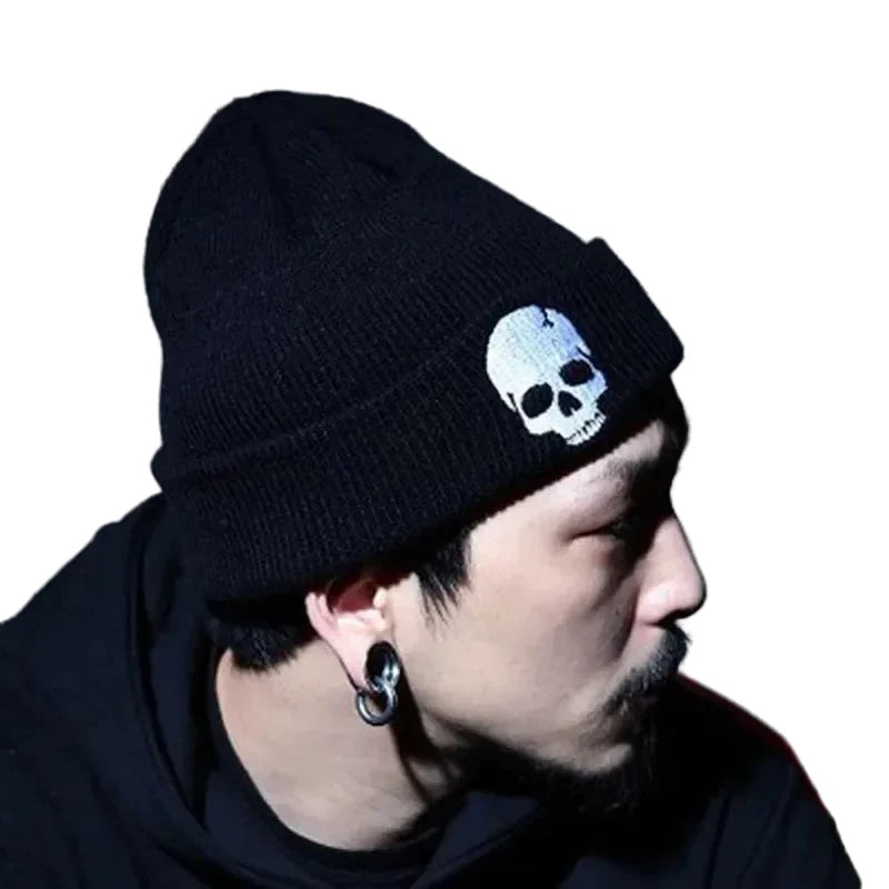 Men's Black Red White Embroidered Skull Beanie - alternate view, shown with a person (2 of 3)