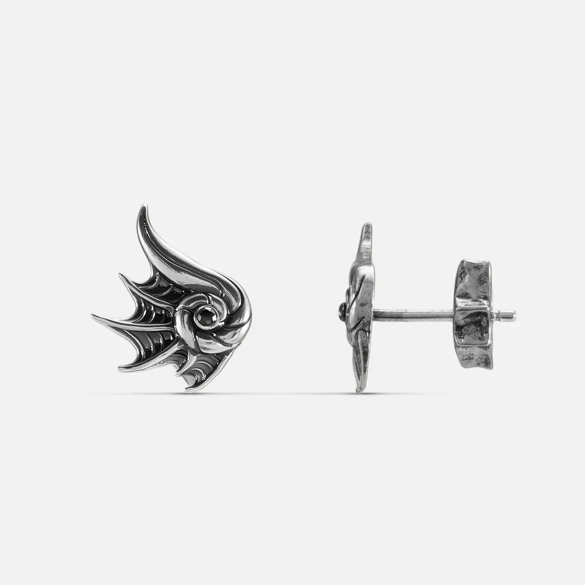 Silver Abyss Conch Ear Studs with curled conch shape, fin-like ridges, black zircon center, and flat back post on a clean background.