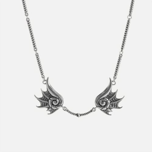 Silver Abyssal Bind Necklace with twin conch-like forms, shell ridges, central rope chain detail, and antiqued finish on a clean background.