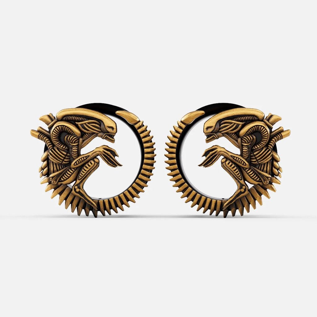 Pair of gold Alien Invasion tunnels with curled biomechanical creature design