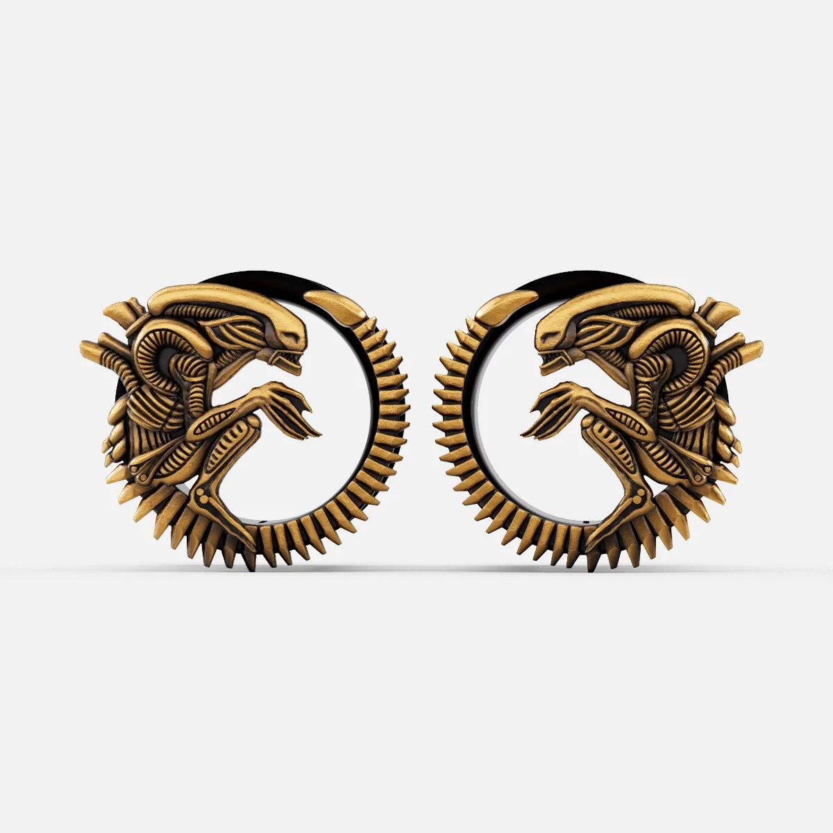 Pair of gold Alien Invasion tunnels with curled biomechanical creature design