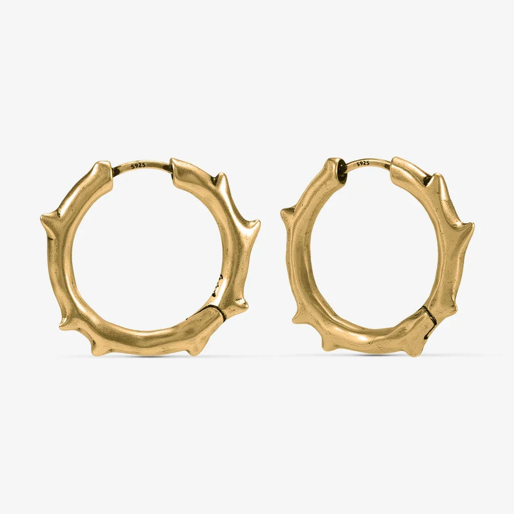 Gold-tone Ancient Thorn Hoops feature thorn-shaped spikes and an antiqued finish.