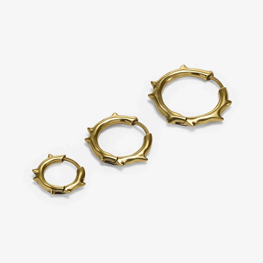Gold-tone Ancient Thorn Hoops are shown in multiple sizes with an antiqued thorn hoop design.