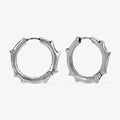 Silver-tone Ancient Thorn Hoops feature a protective thorn silhouette.