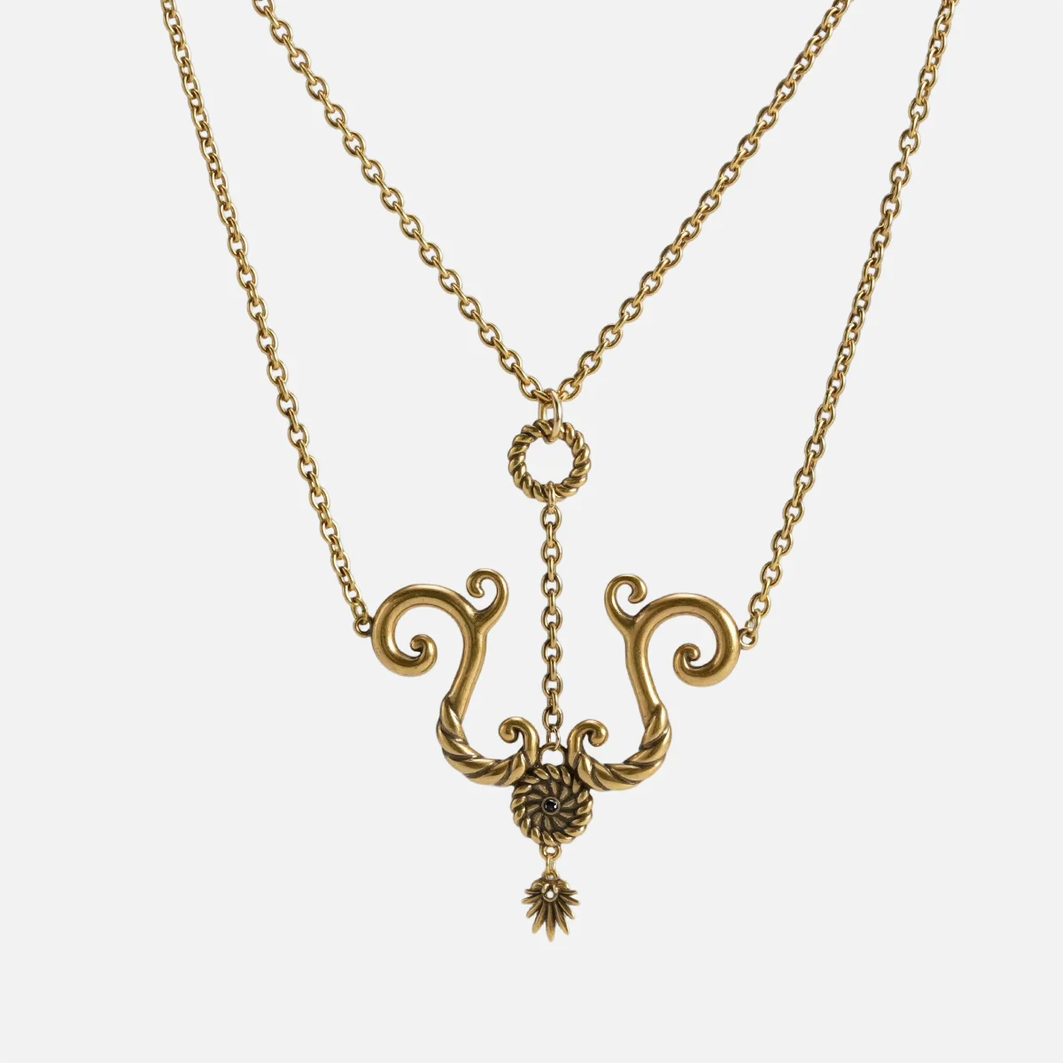 The Tideworn Knot Necklace is shown with an antiqued finish and a stainless steel chain against a plain white background.