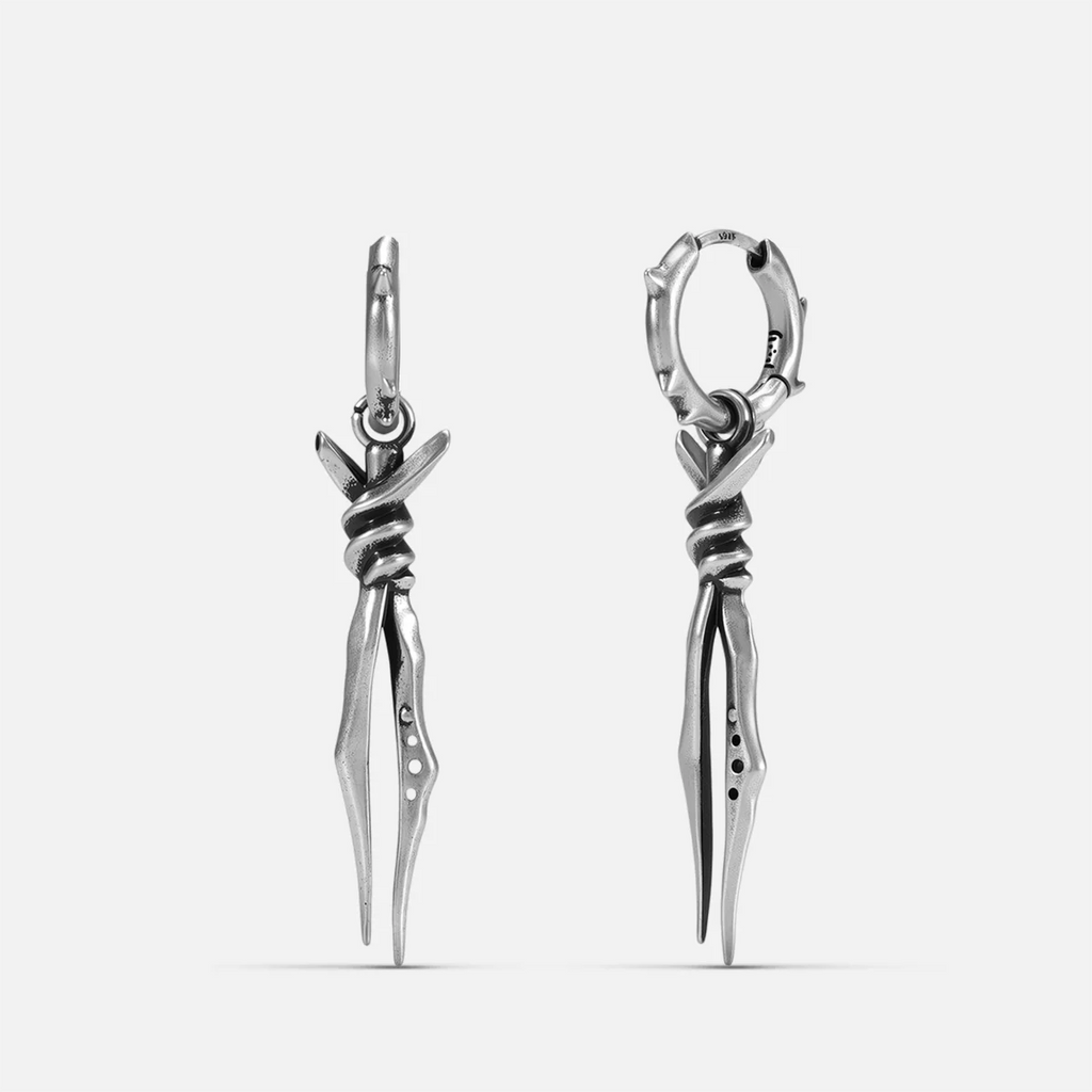 Silver-tone Bound Twin Earrings feature bound twin spike pendants and a hammered hoop design.