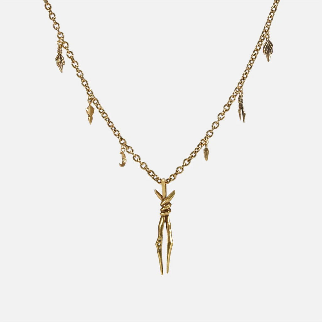 The gold-tone Bound Twin Necklace features a twin spike pendant and an antiqued charm chain.