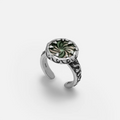 Charybdis Maw Ring in antiqued silver with swirling abalone shell center, carved wave-like edges, and open ring design on a clean background.