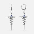 Silver-tone cosmic flow earrings with a spiral spike design and a blue bead center, shown as a pair