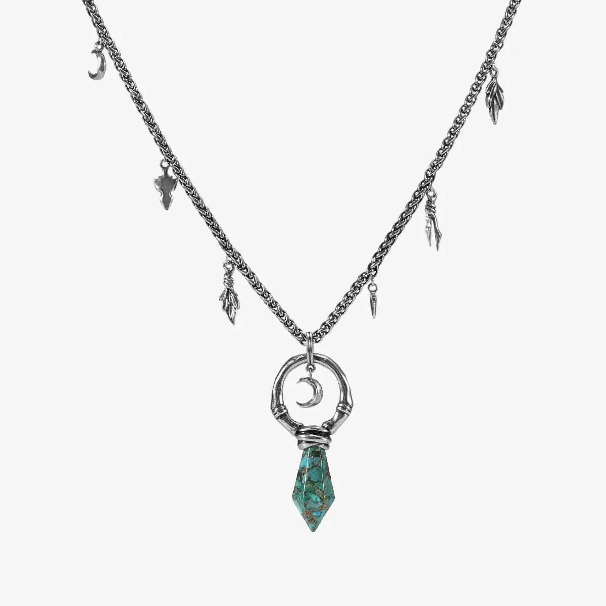 Crescent Ward Necklace in silver plating with crescent moon ring, turquoise spike pendant, and antiqued finish