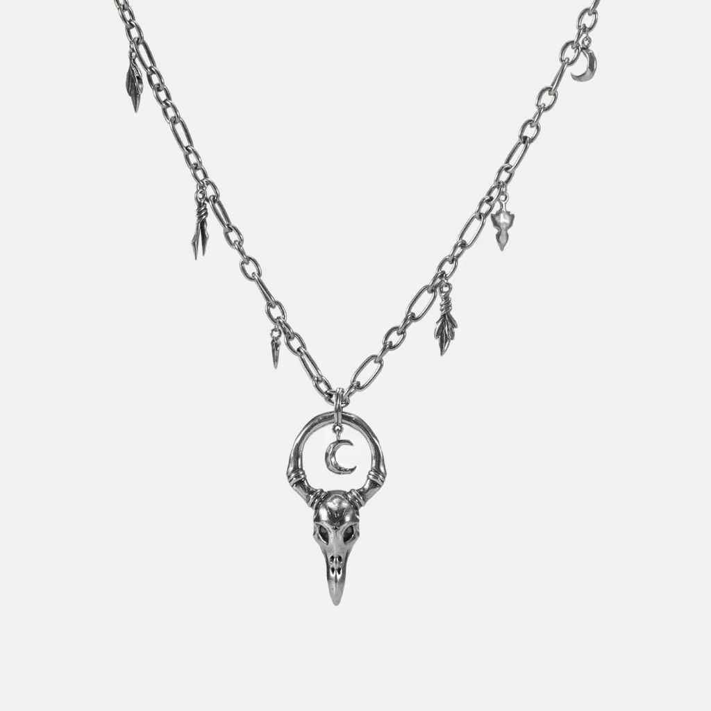 Crow Ward Necklace in silver plating with bird skull pendant, crescent moon detail, and antiqued finish
