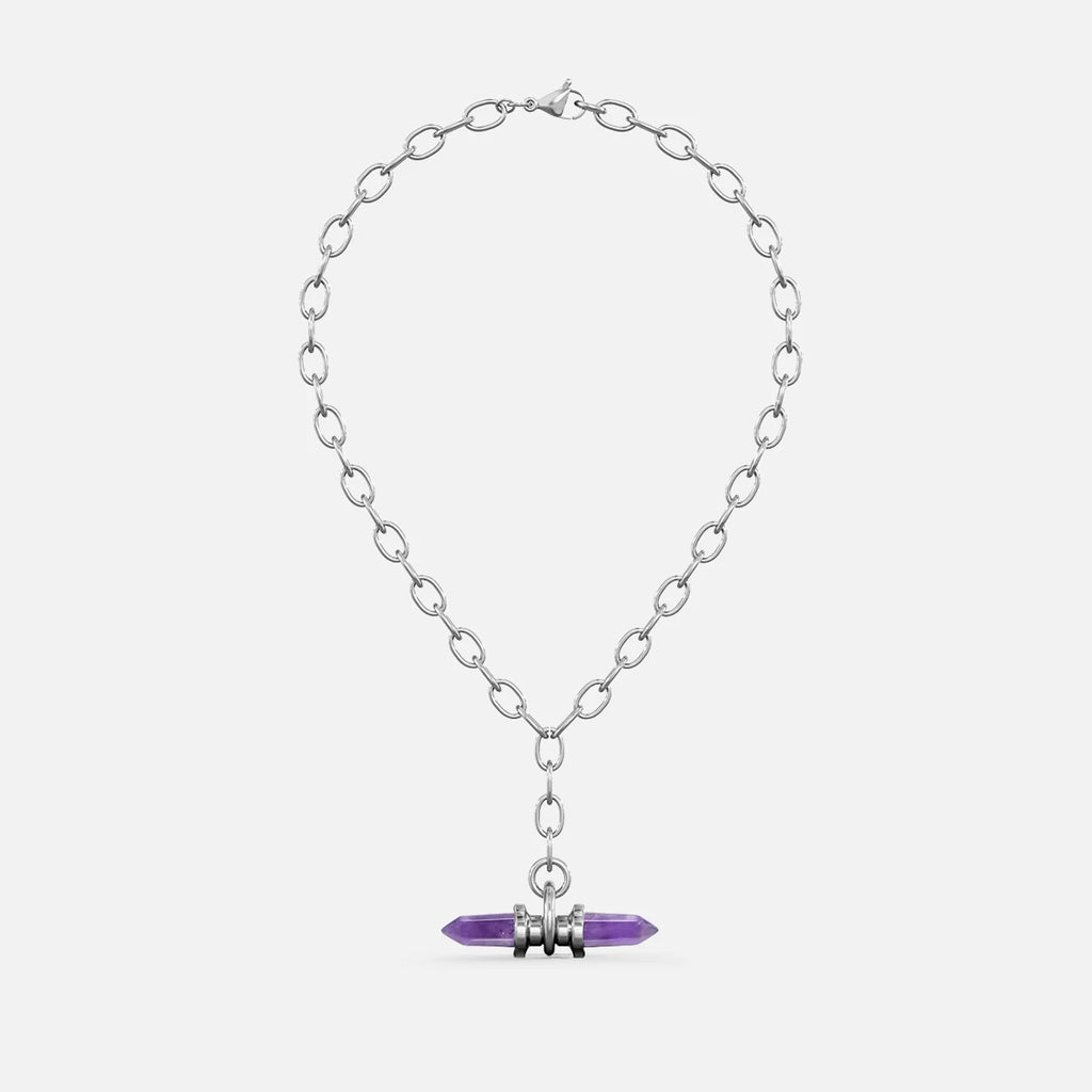 Silver-tone chain necklace with a purple crystal prism pendant wrapped in metal rings, shown flat against a plain background
