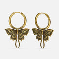 Pair of gold-tone Enchanted Moth hoop earrings with engraved wings, eye details, and long curled tails