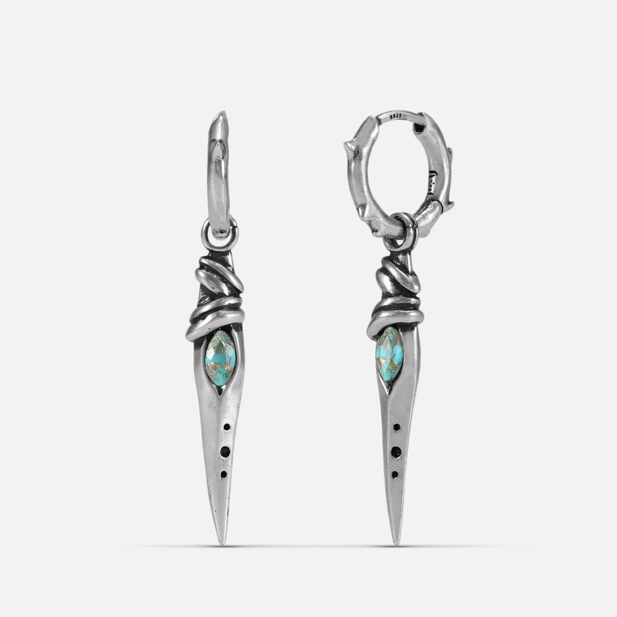 Silver-tone Eye Dagger Earrings feature eye-shaped stone inlays and a long dagger drop design.