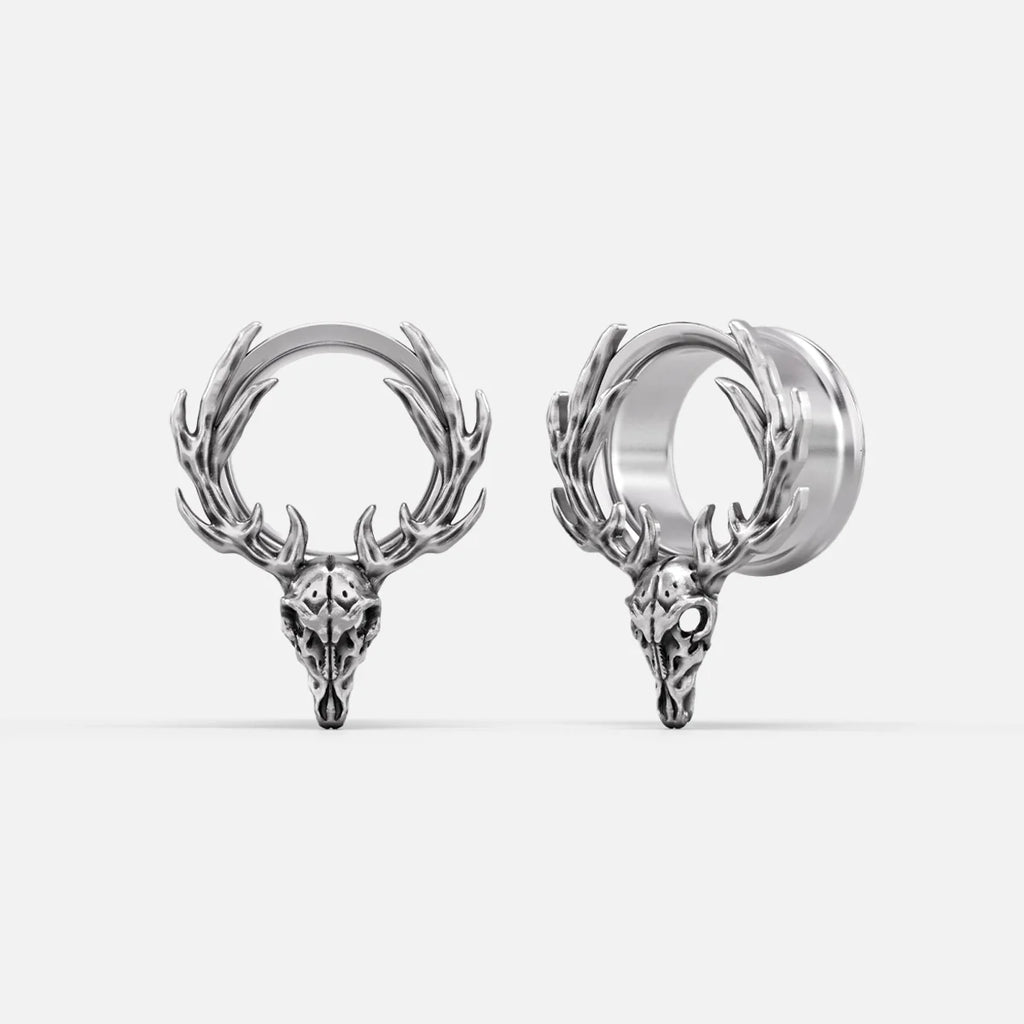 Silver-tone deer skull hoop earrings with antler details shown from front and side angles