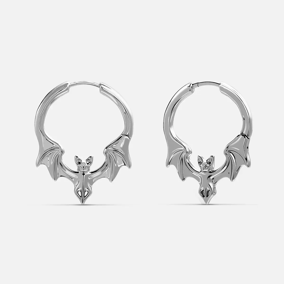 Gothic Bat Earrings in 925 sterling silver, pair shown on white, featuring sculpted bat wings and a pointed bat-head center.