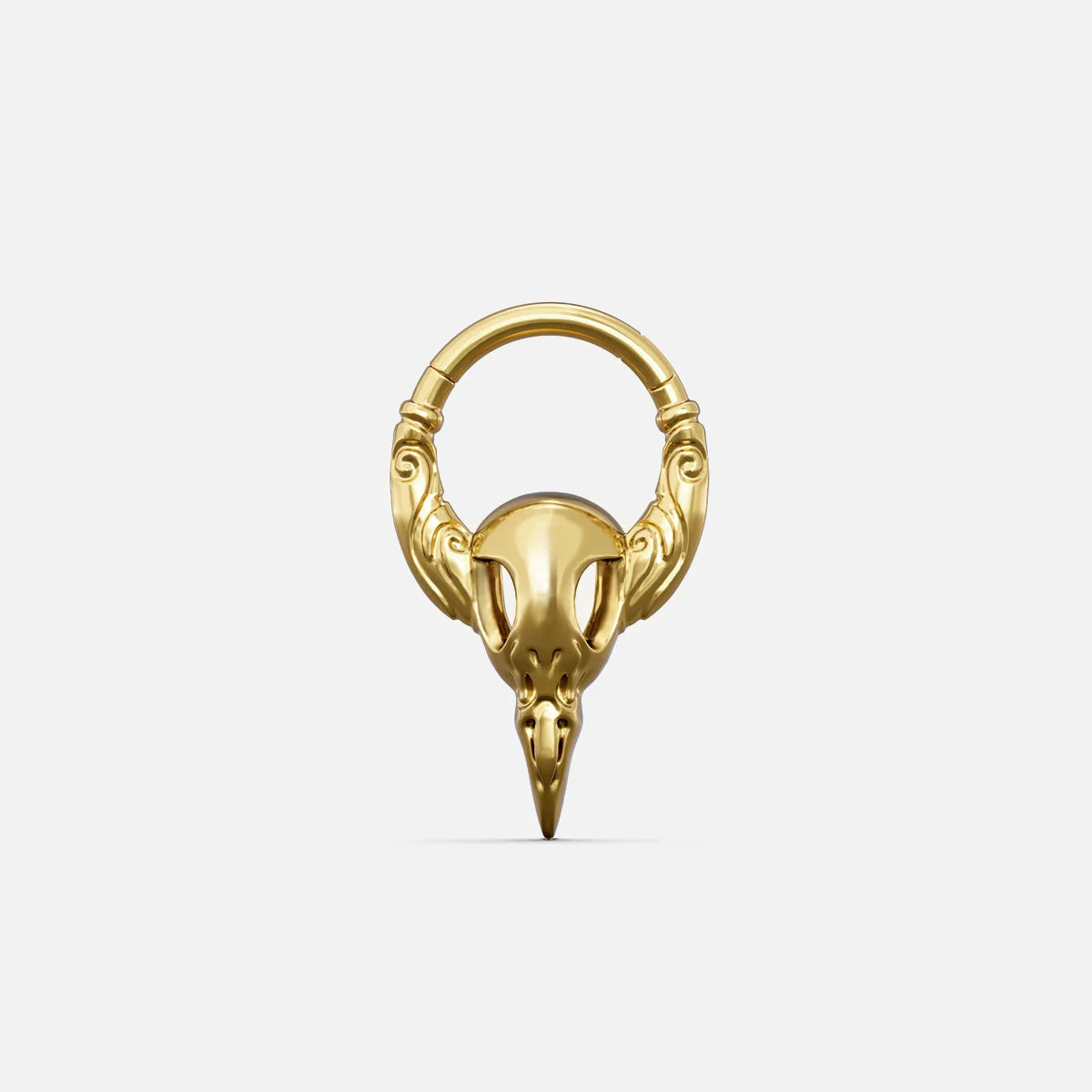 Gold-tone Gothic Raven Clicker with a sculpted raven skull, pointed beak, and decorative ring details.