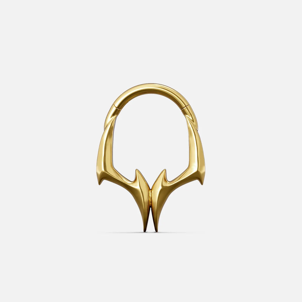 Gold-tone Gothic Talon Clicker with symmetrical claw-like points and a sharp angular profile.