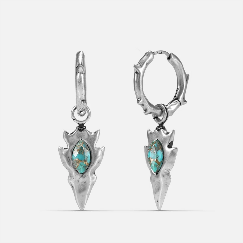 Silver-tone Knapped Stone Earrings feature turquoise marquise stones and arrowhead drop pendants.