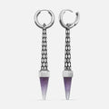 Silver-tone hoop earrings with textured tapered bars ending in purple crystal points, front view