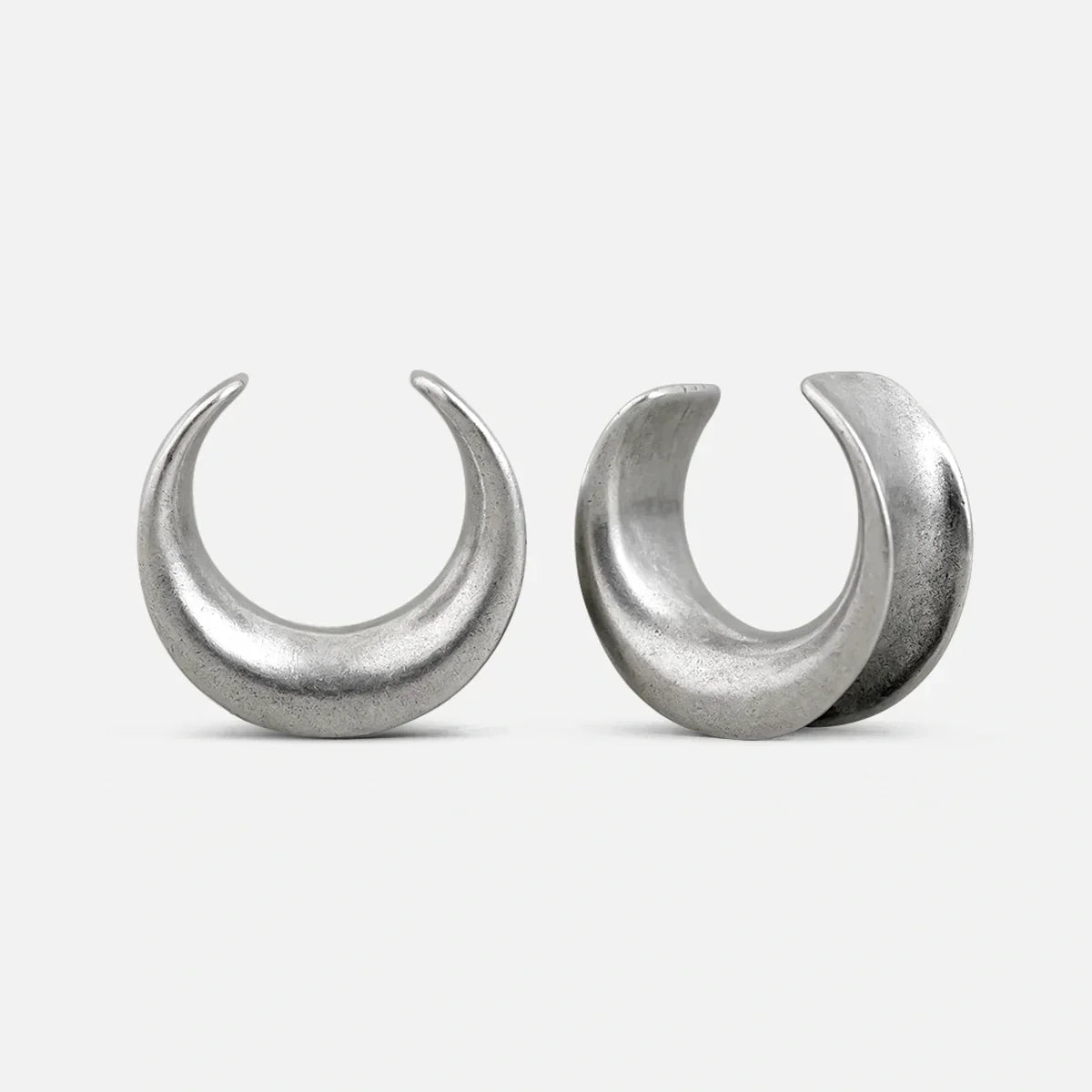 Pair of silver Lunar Eclipse tunnels with crescent-shaped openings