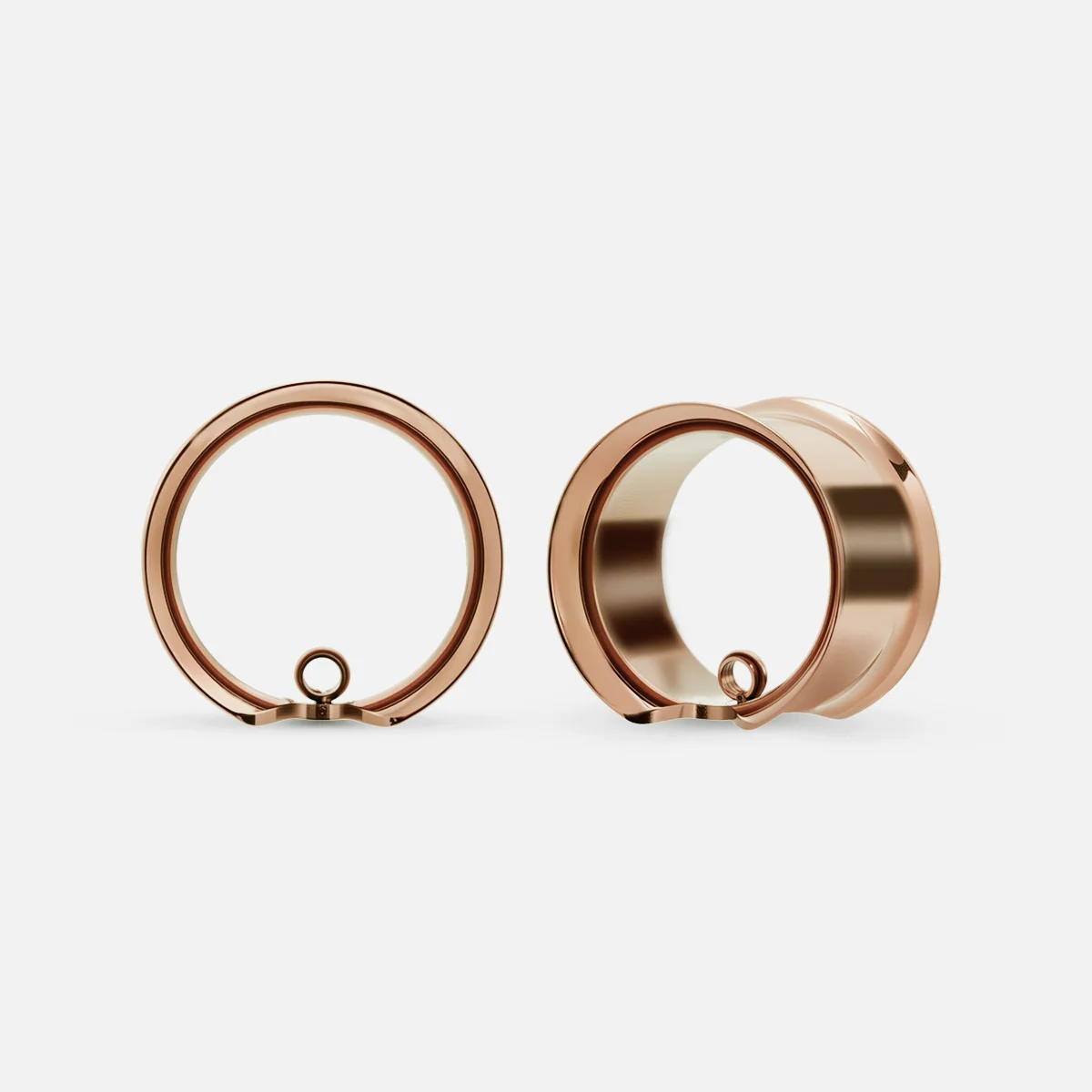 Rose gold-tone modular ring tunnels shown in front and angled side views with a small lower loop