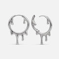 Molten Drop Earrings in 925 sterling silver, pair shown front and side on white, highlighting the sculpted molten-drip hoop s