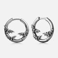 Silver-tone hoop earrings with bats forming a crescent moon shape, shown as a pair