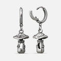 Silver-tone huggie hoop earrings with dangling textured mushroom charms, shown as a matching pair