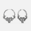Ornate Affection Earrings in 925 sterling silver, pair shown on white, featuring scrollwork hoops with a sculpted sacred-hear