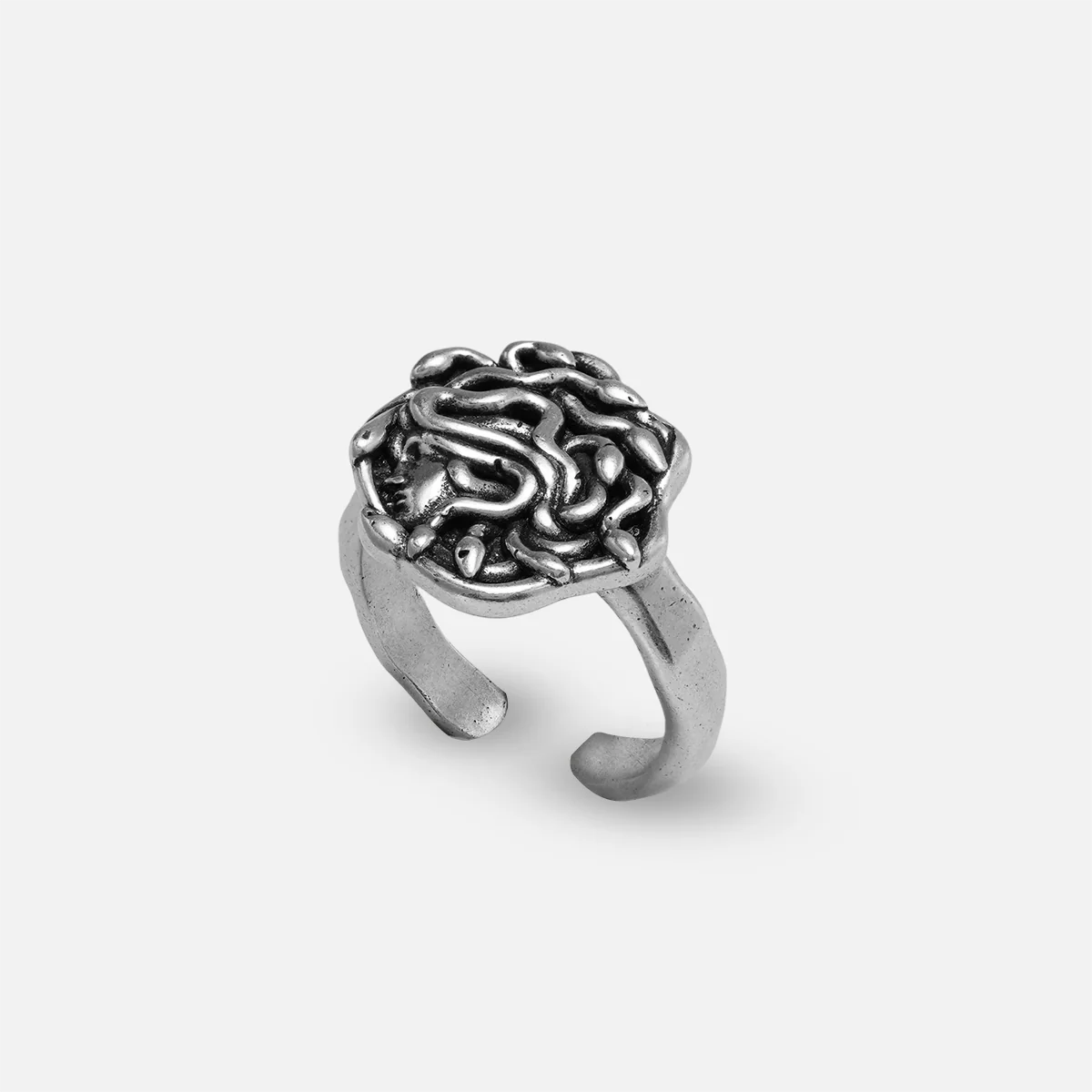 petrified gaze ring in silver shown in an angled view, featuring a medusa-inspired ring face with sculptural snake details