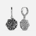 petrifying gaze dangle earrings in silver shown in a front and back view, featuring medusa-inspired drop charms suspended from small hoops