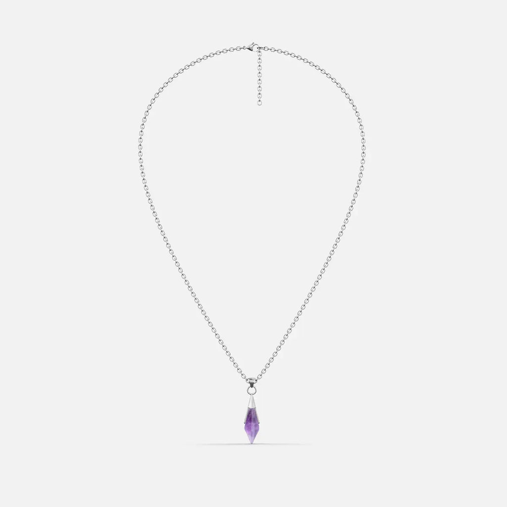 Silver-tone Prism Apex Necklace with a pointed purple crystal pendant on a fine chain, shown on a light gray background.