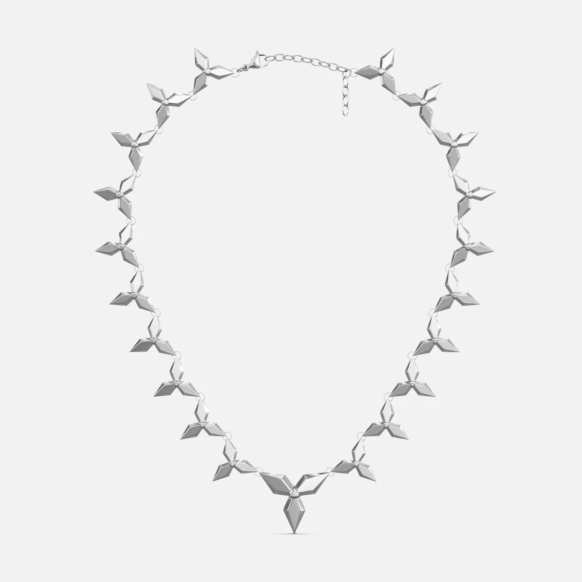 Silver-tone petal necklace with layered diamond-shaped links and a pointed pendant, laid flat