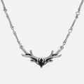 Silver Sacred Antler Collar Necklace with black obsidian stone, antler-shaped centerpiece, and bone-inspired chain details on a clean background.
