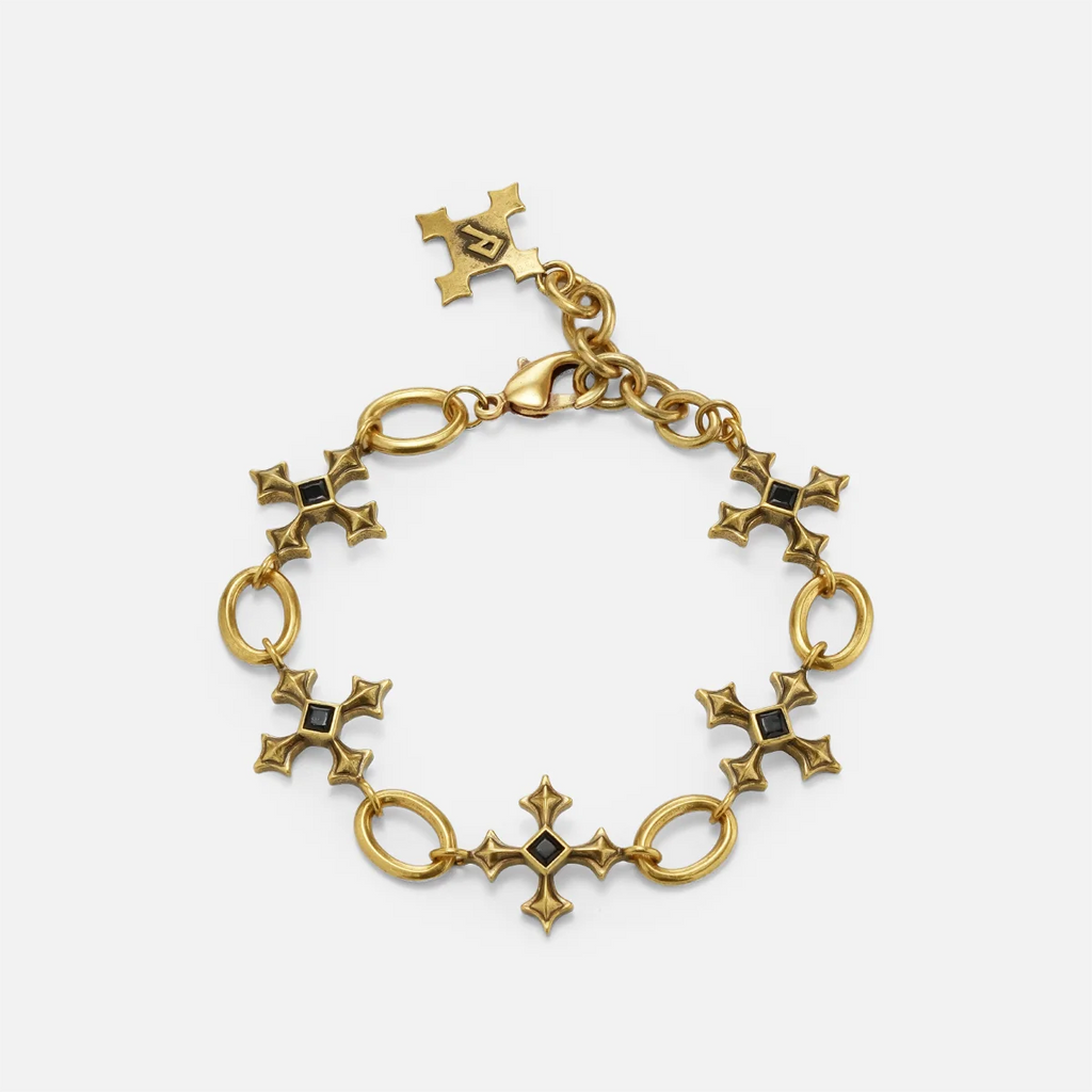 Silent Litany Bracelet in antiqued 18K gold with gothic cross-inspired links and black obsidian, shown in a full circle on wh