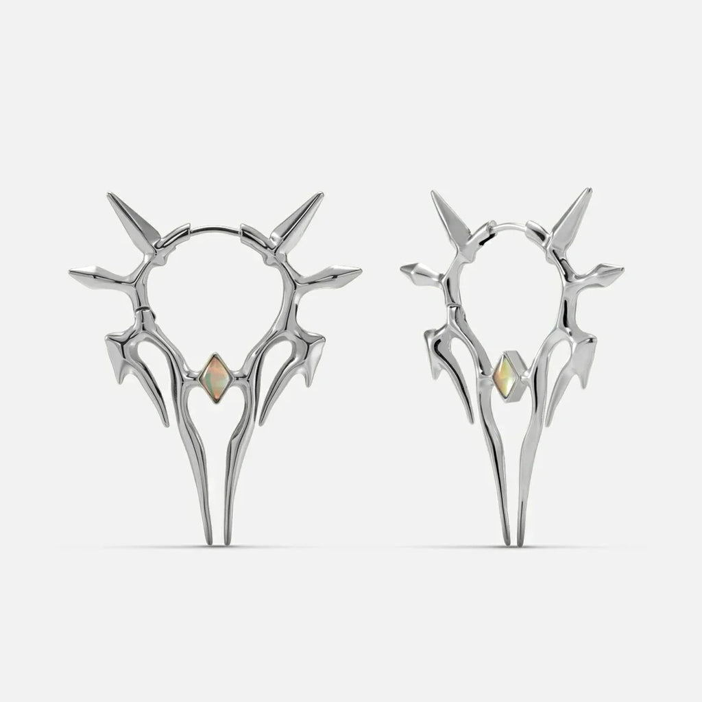 Silver-tone Solar Guardian earrings with branching spiked halos and iridescent center stones