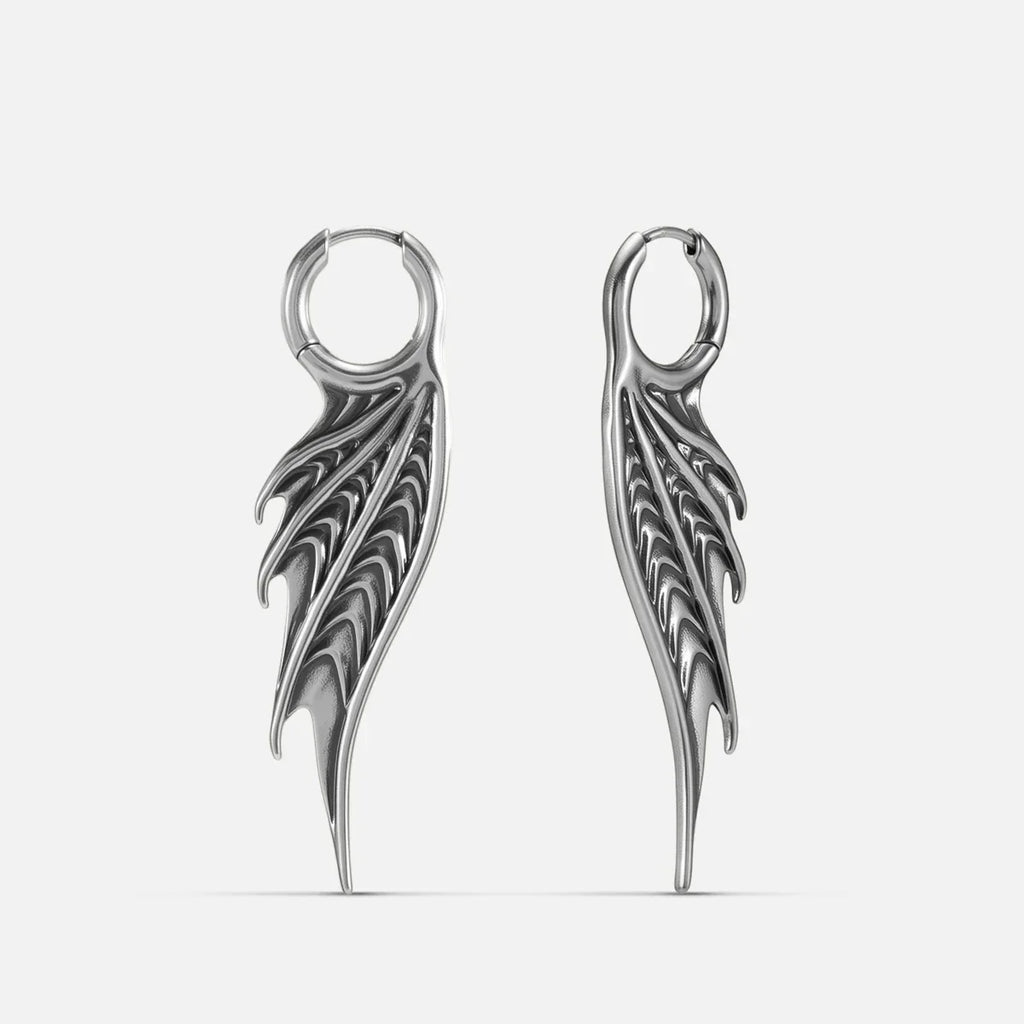 Silver Spined Wing Earrings with long ribbed wing drops, sharp fin-like ridges, and hoop design on a clean background.