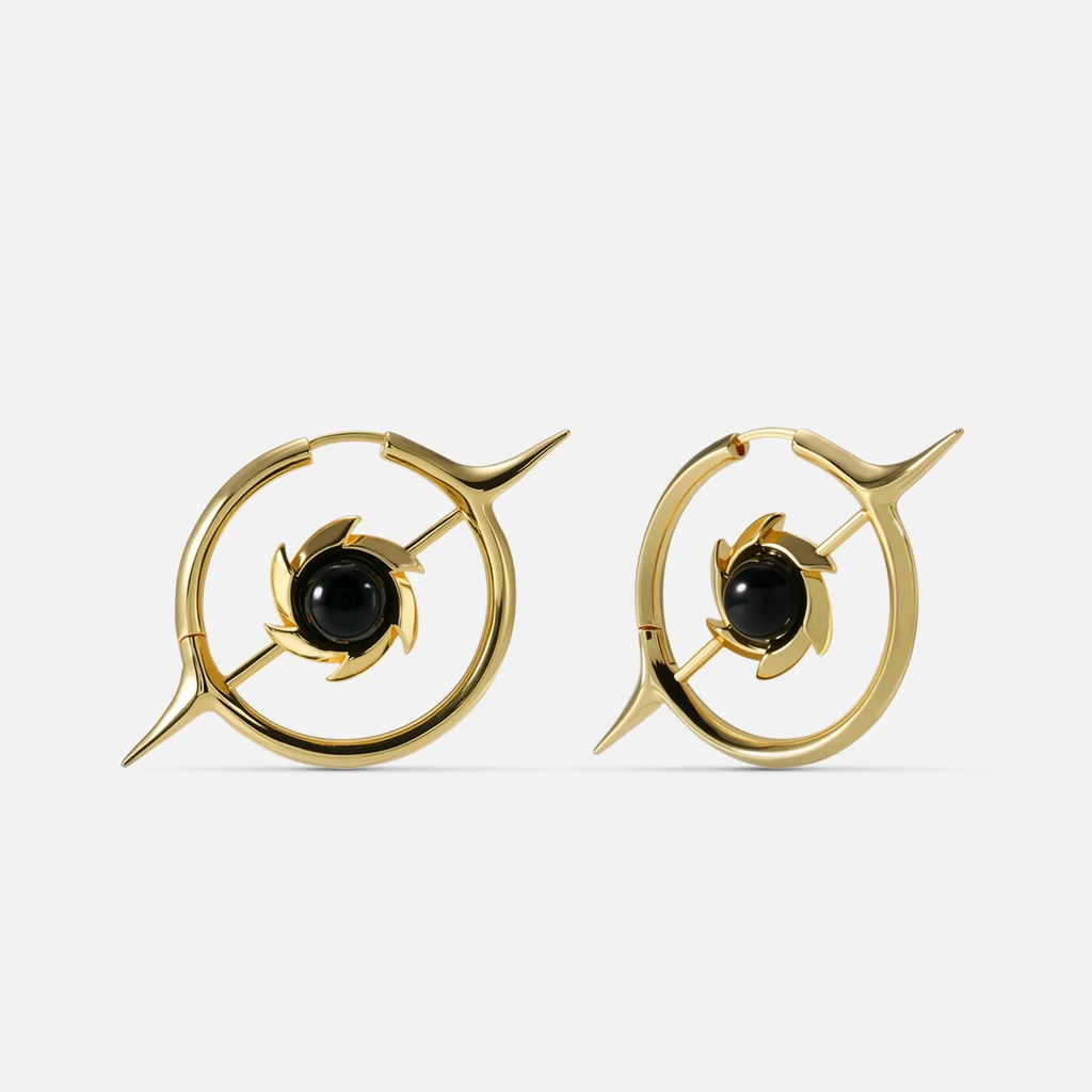 Gold-tone hoop earrings with a star design and round black stone center, front view pair