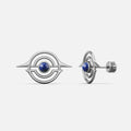 Silver-tone ear studs with concentric ring design and blue stone center, front and side view