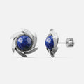 Silver-tone pinwheel stud earrings with a round blue stone, front and side view