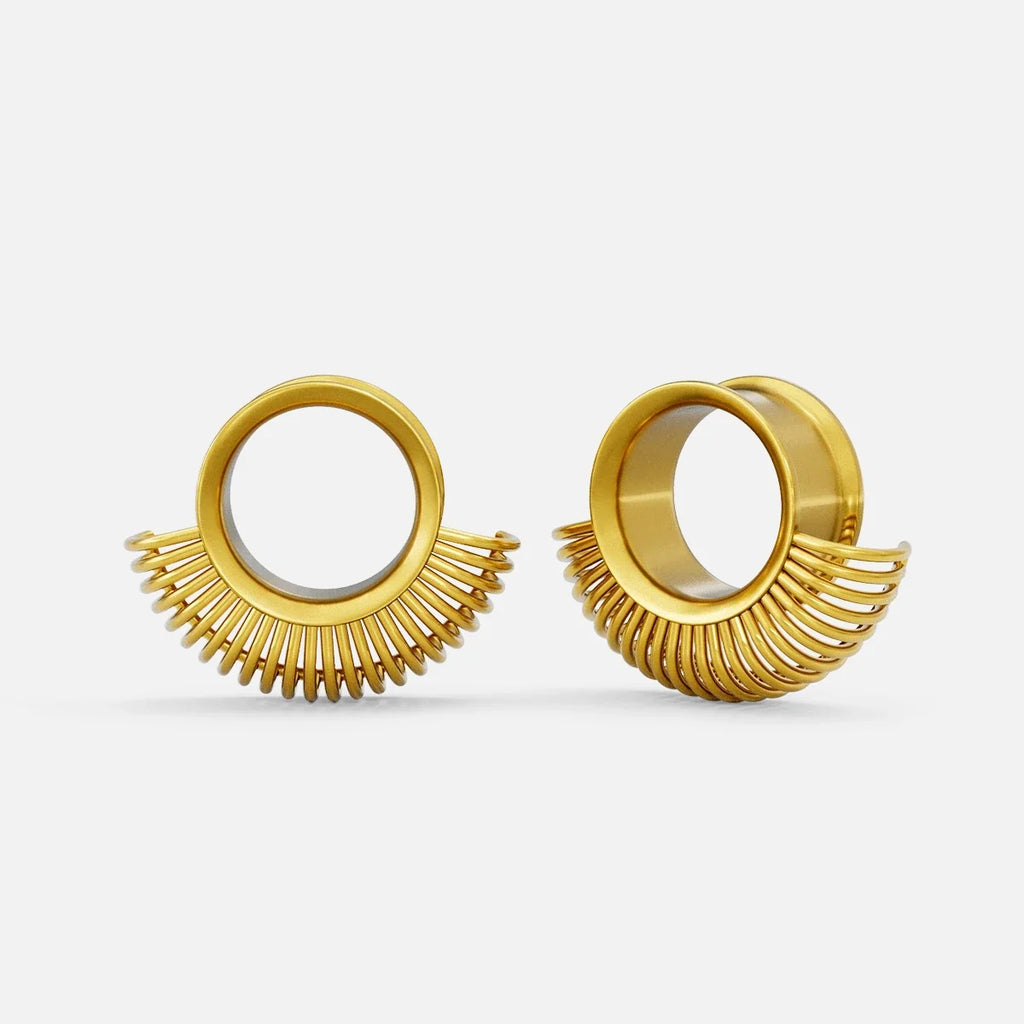 Pair of gold-tone symmetrical radiance tunnels with a sunburst fringe design around a round center