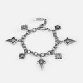 Antiqued silver-tone Unblinking Procession Bracelet with a substantial link chain and sculpted eye charms in radiating, oval, and pointed frames.