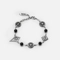 Antiqued silver-tone Unseen Orbit Bracelet with black obsidian beads, eye-shaped links, and sculpted eye medallions in pointed frames.