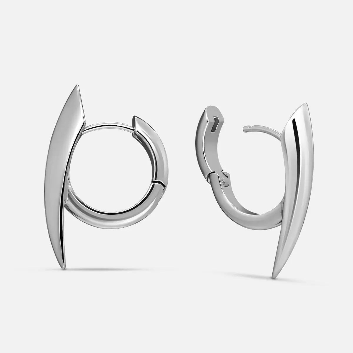 Venom Claw Earrings in 925 sterling silver, pair shown on white, featuring polished curved claw points around compact silver 